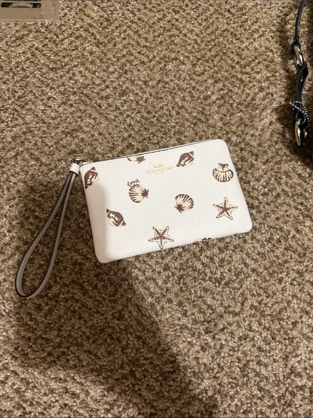 Coach Cream Seashell Print Wristlet wallet with Gold Logo